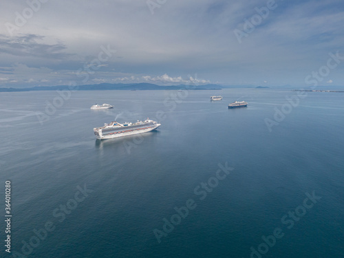 Beautiful aerial view of a lot of Cruise Ships on the middle of the ocean © Gian