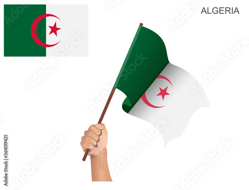 Algerian state flag hoisted with a stick held by hand to inflame the spirit of statehood