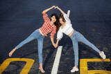 Two girls in jeans were photographed on the street