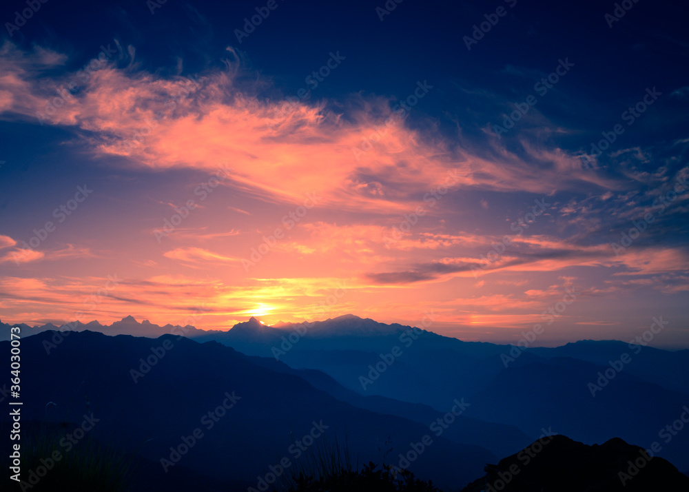 Beautiful panoramic landscape sunrise view of the Himalayan snow mountains from Chandrashila peak in Chopta, Uttarakhand, India,.