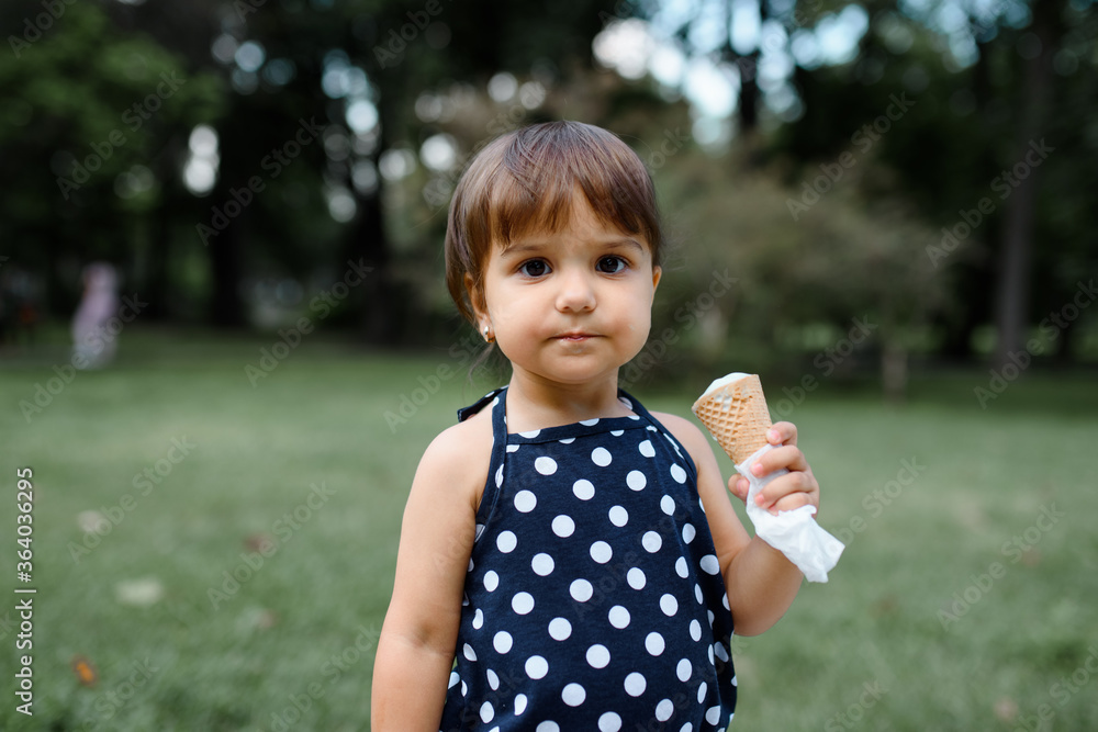 girl kid is eating an ice cream girl kid is eating an ice cream