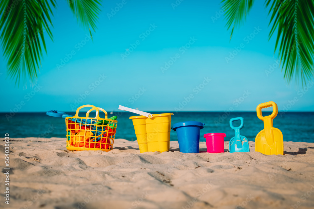 kid toys on tropical sand beach, family vacation kid toys on tropical sand beach, family vacation