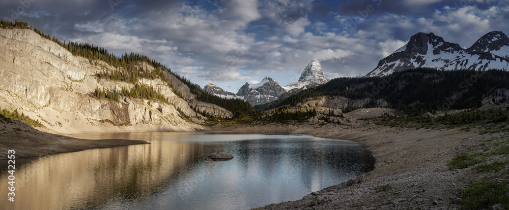 Beautiful Panoramic View of Og Lake in the Iconic Mt Assiniboine Provincial Park near Banff, Alberta, Canada. Canadian Mountain Landscape Background Panorama. Cloudy Sunset