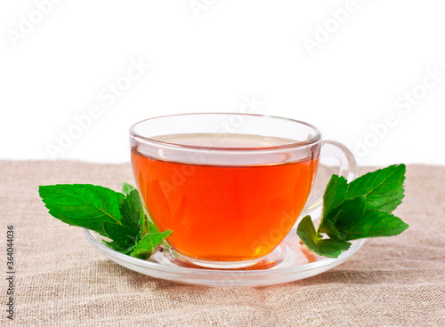 Herbal tea with mint leaves isolated on a white background. 