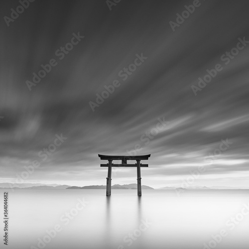 Long exposure shot of Shirahige shrine Torii gate at sunset at Lake Biwa, Shiga Prefecture, Japan