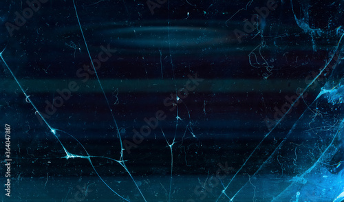 Broken glass overlay. Fractured screen. Blue purple aged stained laptop display with dust scratches.