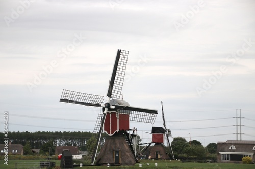 Red white wooden seesaw mill in the Doespolder near Hoogmade in South Holland the Netherlands.