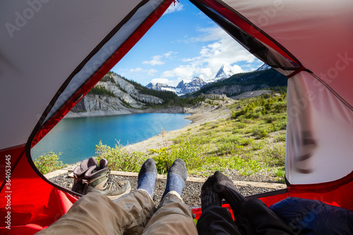 Camping inside a Tent in the Iconic Mt Assiniboine Provincial Park near Banff, Alberta, Canada. Canadian Mountain Landscape in Background. Concept: Adventure, Hiking, Backpacking, Freedom