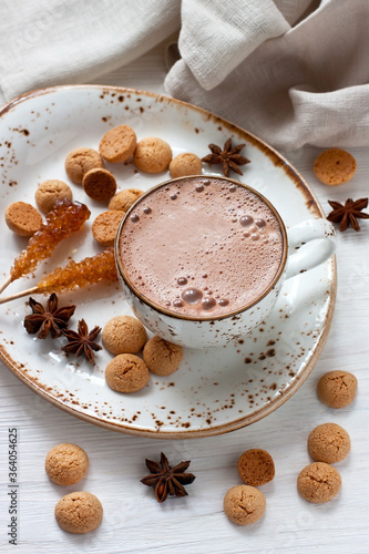 Hot cocoa drink with cookies, anise and  vanilla