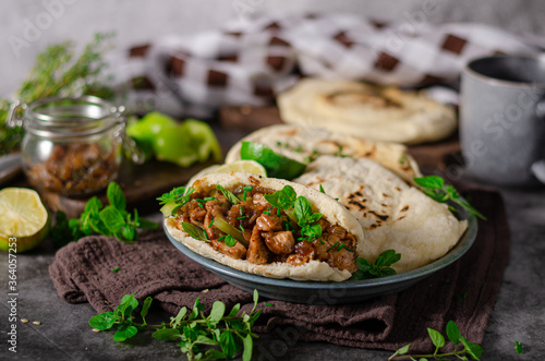 Homemade pita bread with meat and herbs