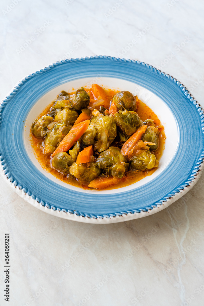 Turkish Style Healthy Organic Vegan Vegetarian Hot Brussel Sprouts Food with Carrots and Tomato Paste.