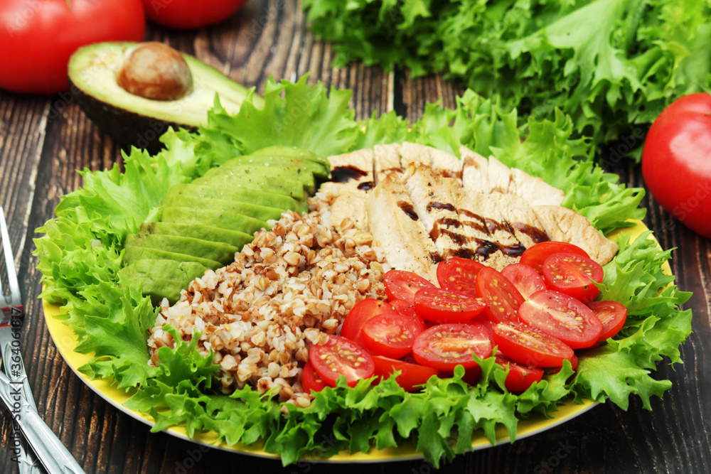 Turkey breast, avocado, salad and buckwheat as healthy lunch Turkey breast, avocado, salad and buckwheat as healthy lunch