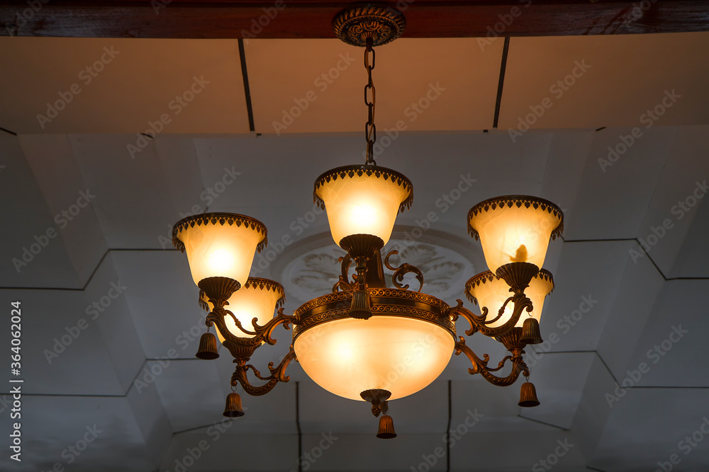 old fashioned lamp. vintage chandelier hanging on ceiling