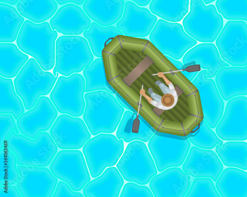 A man in a rubber inflatable boat. Top view. Fisherman. View from above.