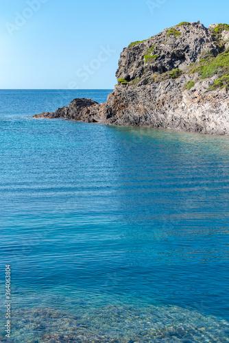 Sea landscape with Cap de Creus  natural park. Eastern point of Spain  Girona province  Catalonia. Famous tourist destination in Costa Brava. Sunny summer day with blue sky and clouds