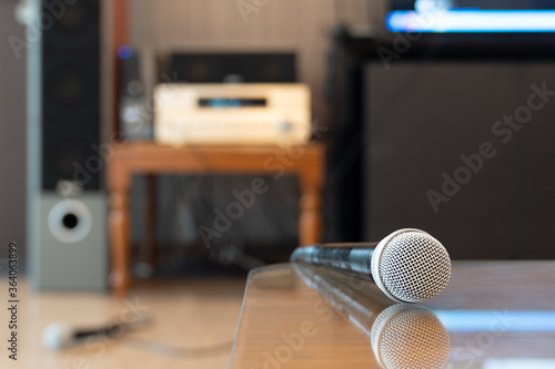 Microphone in karaoke room background.