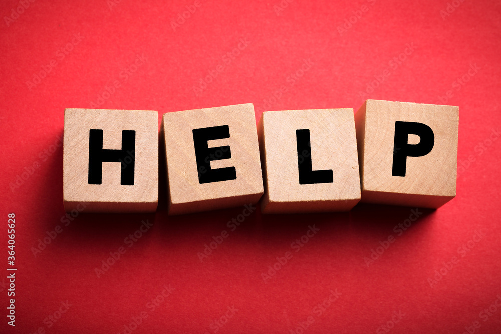 Obraz premium Help Concept Wooden Cube Blocks