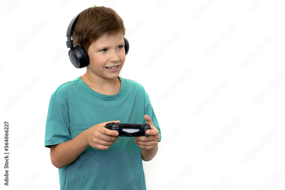 Boy plays a computer game with headphones and a joystick, game console. Boy plays a computer game with headphones and a joystick, game console.