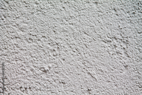 Texture of a rough plaster wall. Freshly whitewashed.