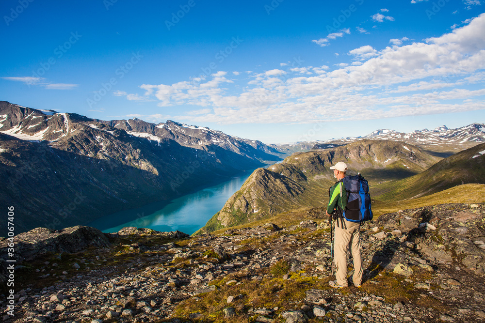 A hiker enjoying a world class view in Jotunheimen Norway