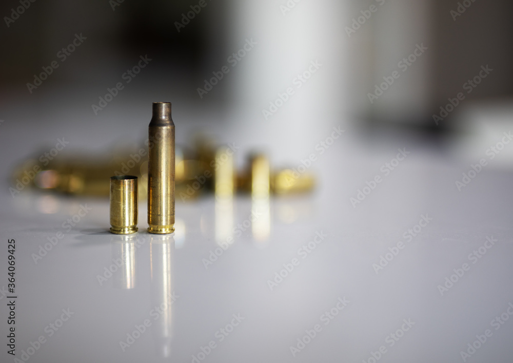 Shot pistol and rifle shells on a white background Shot pistol and rifle shells on a white background