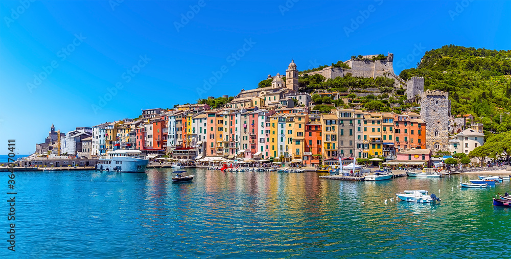A panorama view across the port of Porto Venere, Italy from a boat in the summertime