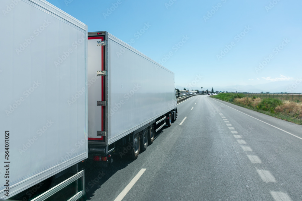 Mega-truck or Road train, special vehicle consisting of a truck and two trailers approved to transport 60 tons. Mega-truck or Road train, special vehicle consisting of a truck and two trailers approved to transport 60 tons.