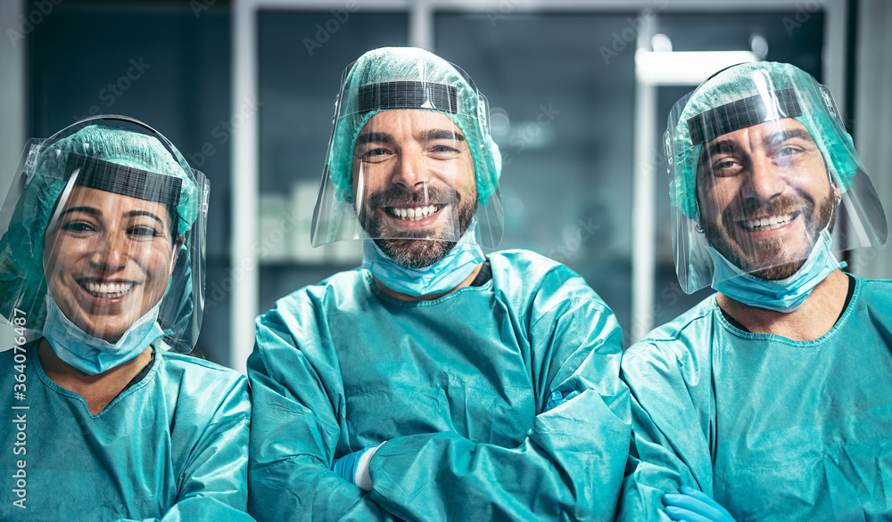 Surgeons smiling after a successful surgical operation - Medical workers the real heroes during corona virus outbreak - Doctor working for stop and preventing spread of coronavirus concept - obrazy, fototapety, plakaty 