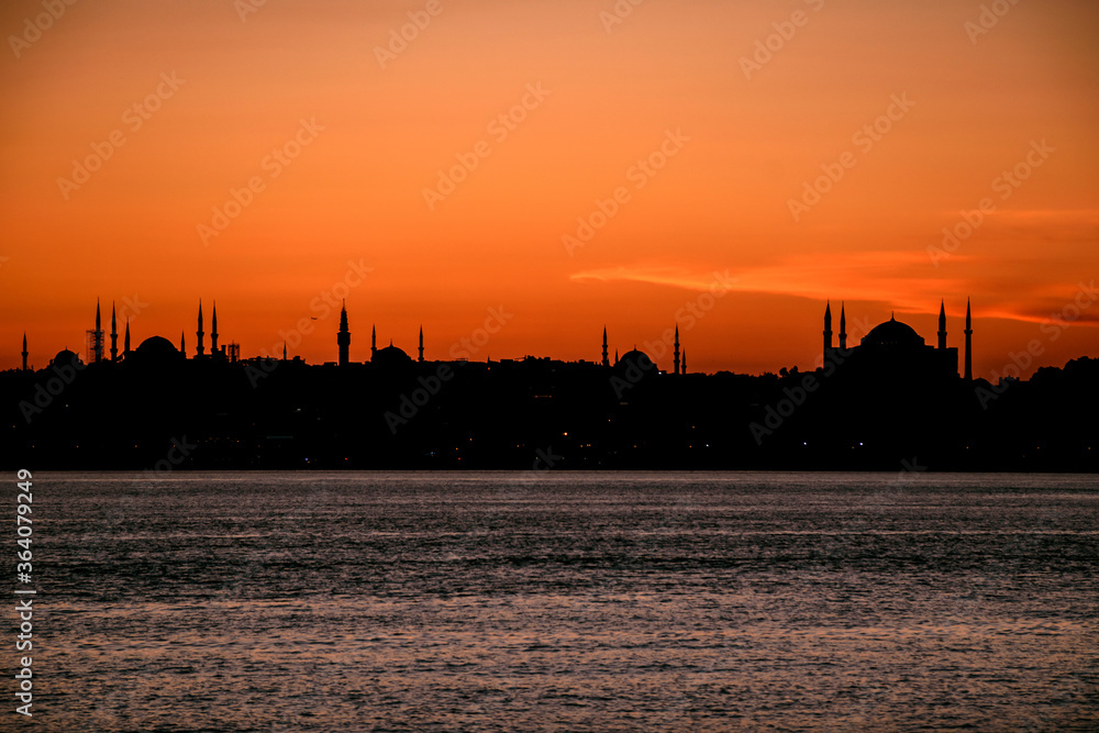 absolute silhouette of the istanbul city with biggest mosques, red sky, sunset. 