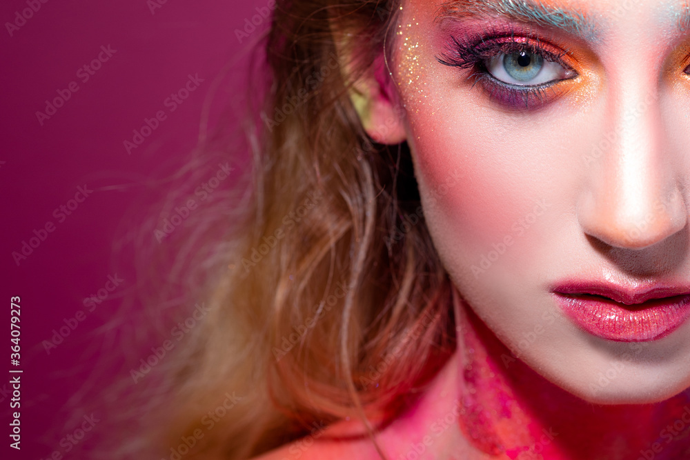 Fototapeta premium Bright makeup and face art, close-up portrait. Creative makeup,