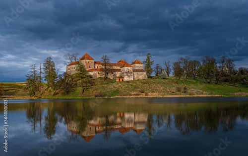 Ancient Svirzh castle at sunset in april 2020. Svirzh village, Lviv region.