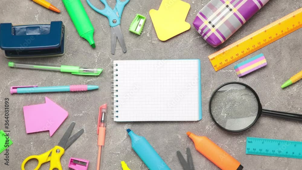 Stop motion of school stationery on grey concrete background. Shot in 4k resolution. Top view Stop motion of school stationery on grey concrete background. Shot in 4k resolution. Top view