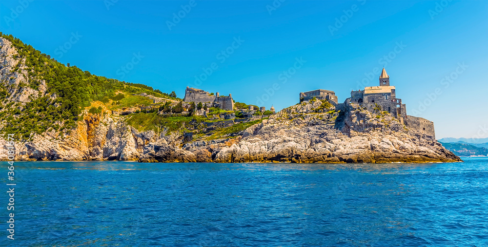 A view looking back towards the promontory and castle in Porto Venere, Italy in the summertime