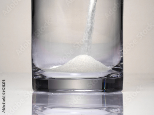 pour powder into a glass. photo