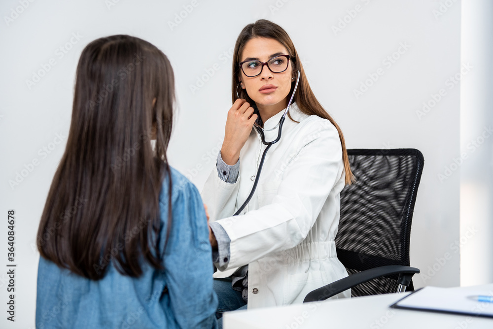 Doctor examining a little girl by stethoscope. Medicine and health care concept. Doctor examining a little girl by stethoscope. Medicine and health care concept.