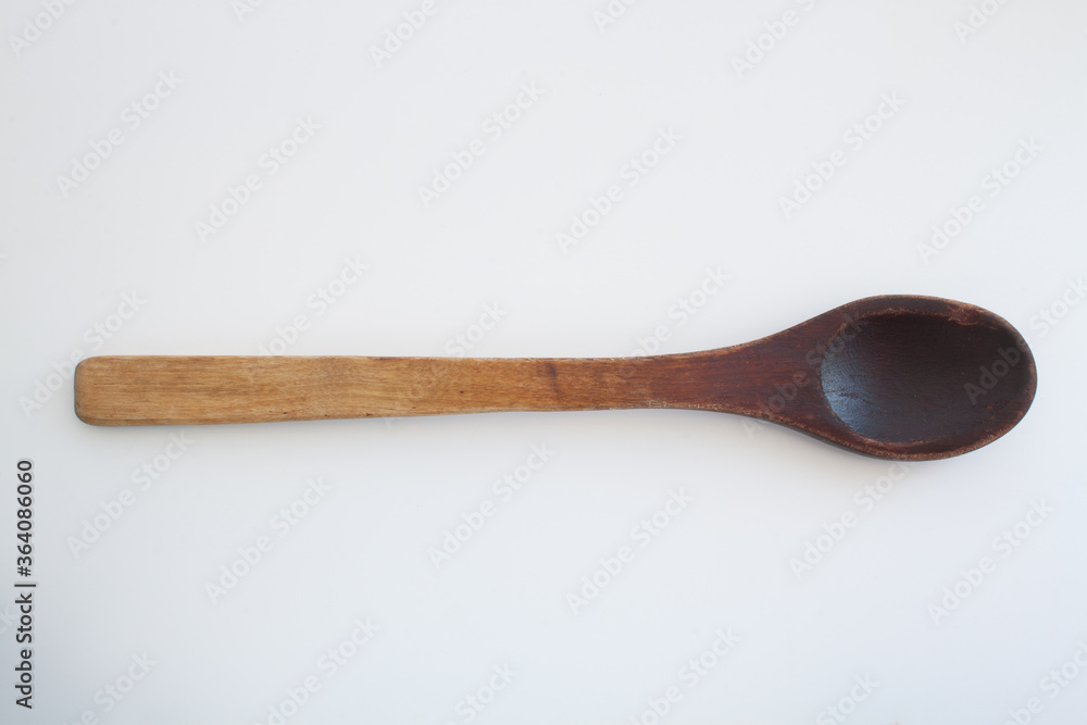 isolated old wooden spoon on a white background
isolated old wooden spoon on a white background