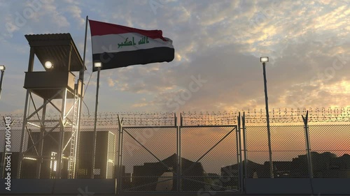 National flag of Iraq above military base at sunset photo