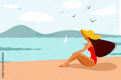 Nice girl in a red swimsuit and a yellow hat on the beach. Summer vacation, vacation.