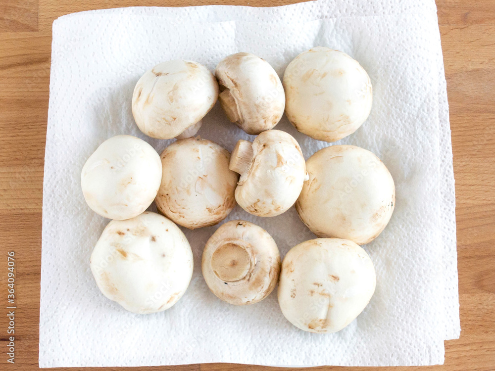 Dry mushrooms on a white kitchen towel after washing. For cooking a soup soup Dry mushrooms on a white kitchen towel after washing. For cooking a soup soup