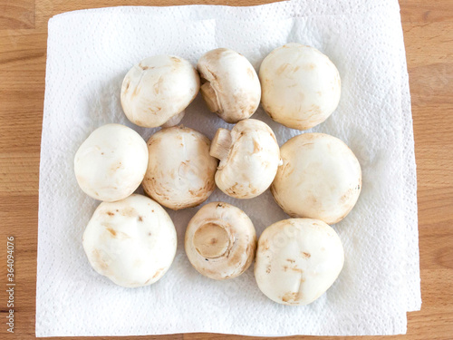 Dry mushrooms on a white kitchen towel after washing. For cooking a soup soup