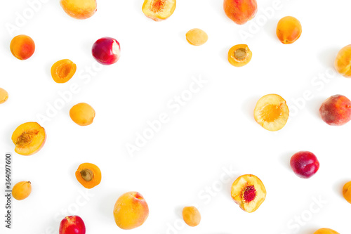 Fruit frame of ripe apricot and peaches isolated on white background. Top view
