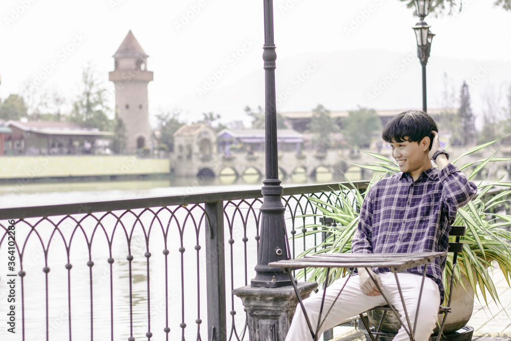 Fototapeta premium Asian man are relaxing with landscape mountain on weekend, Enjoying on holiday