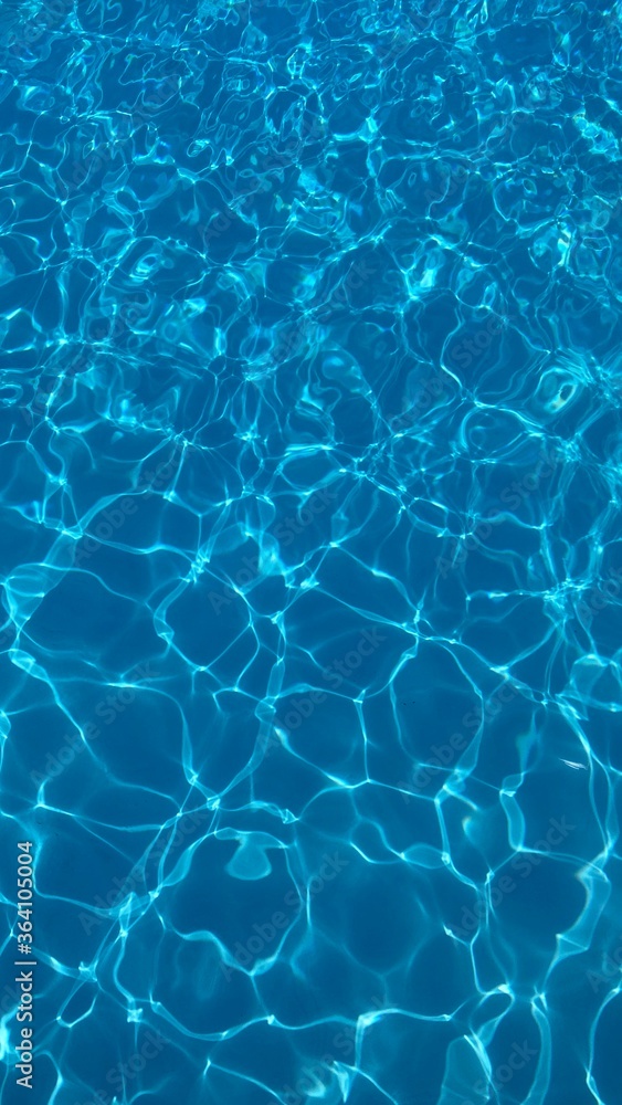 Swimming pool texture water in abstract style on light background. Vacation, holiday. Ripple water. Watercolour abstract texture. Swimming pool water sun reflection background. Summer vacation. Swimming pool texture water in abstract style on light background. Vacation, holiday. Ripple water. Watercolour abstract texture. Swimming pool water sun reflection background. Summer vacation.
