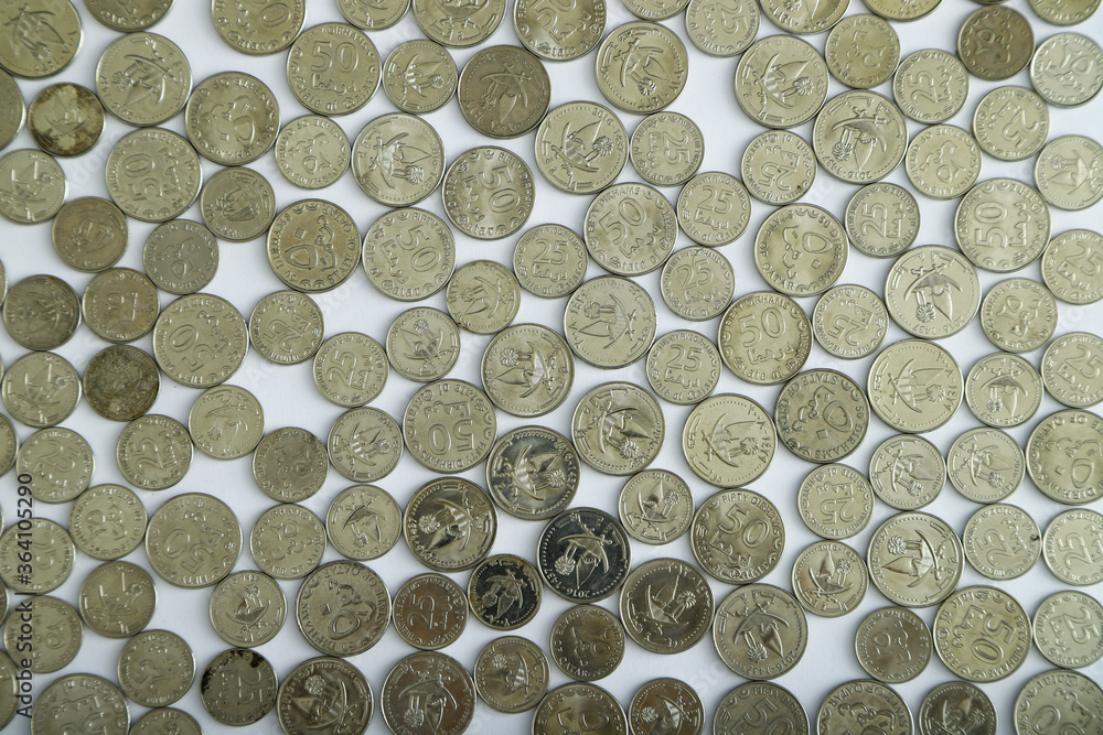 Currencies and money exchange trading concepts. Qatari Coins ,Qatari Currency roll Currencies and money exchange trading concepts. Qatari Coins ,Qatari Currency roll