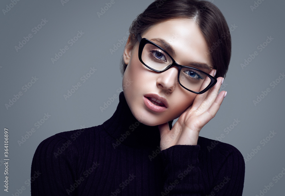 Cute student girl wearing black turtleneck sweater and stylish eyeglasses Cute student girl wearing black turtleneck sweater and stylish eyeglasses