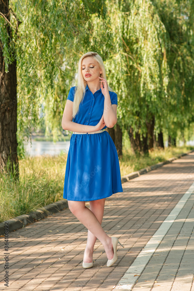 Portrait of a beautiful blonde girl outdoors in summer Portrait of a beautiful blonde girl outdoors in summer
