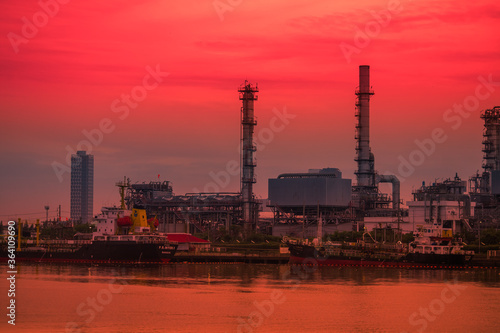 Blurred natural background of the morning sunshine along the river  breathtaking views  cargo ship  oil refinery   boat transportation