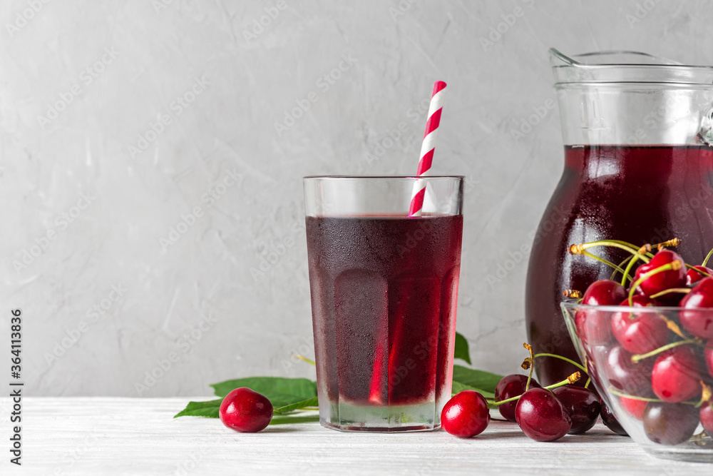 custom made wallpaper toronto digitalCold cherry juice in a glass with a straw and jug with fresh berries on white background. Refreshment summer drink