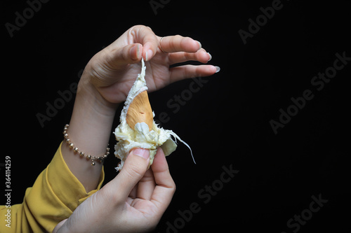 Asian woman's hand holding durian seeds photo