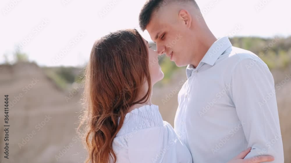 Couple has date in career. People kiss each oher. Portrait of man and woman kissing outside. Couple has date in career. People kiss each oher. Portrait of man and woman kissing outside.